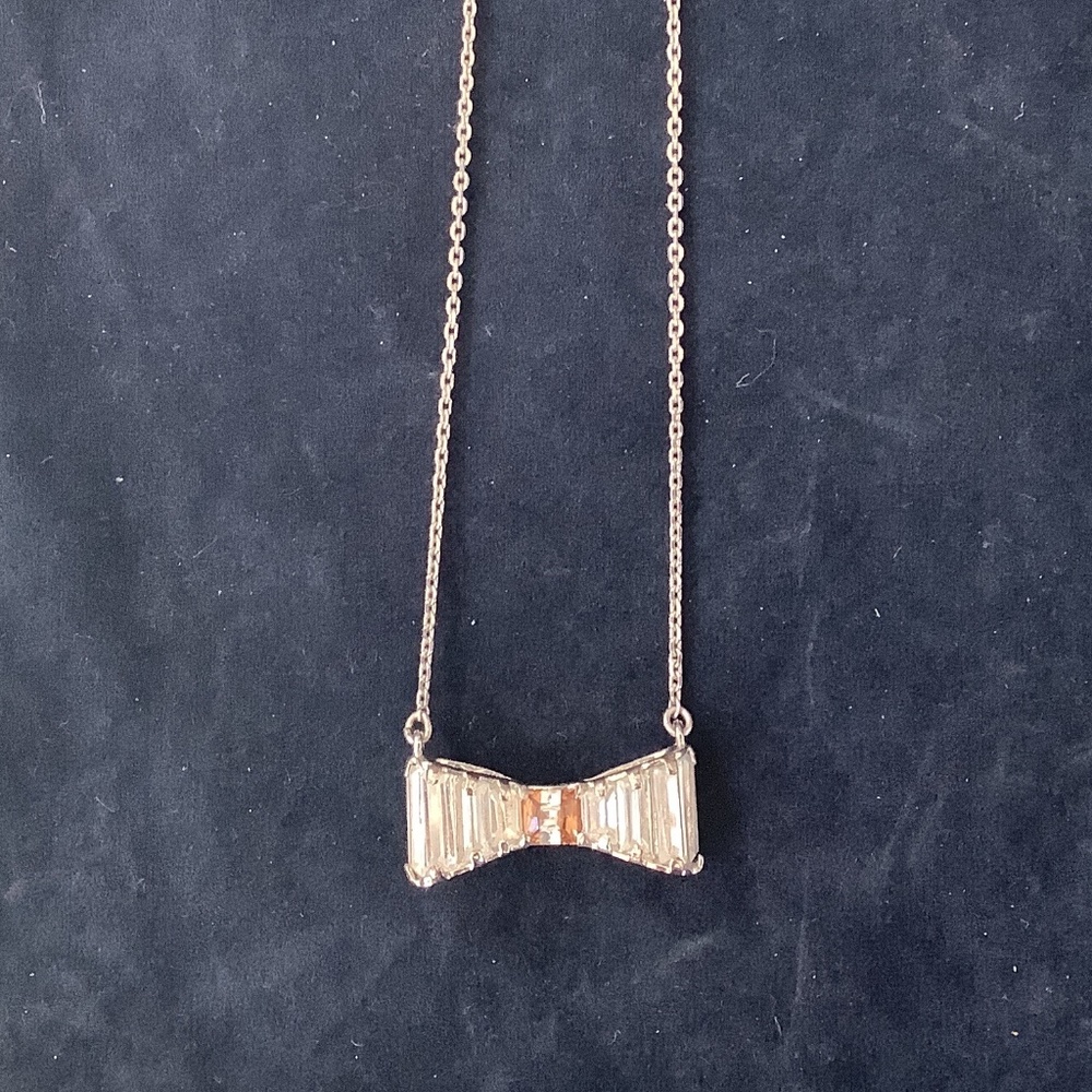 Henri Bendel necklace with a crystal bow,16 inch long, silver finish